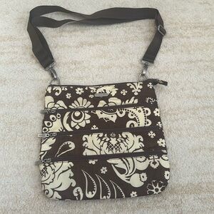 Baggallini cross body bag- brown and ivory flower print.  NWOT